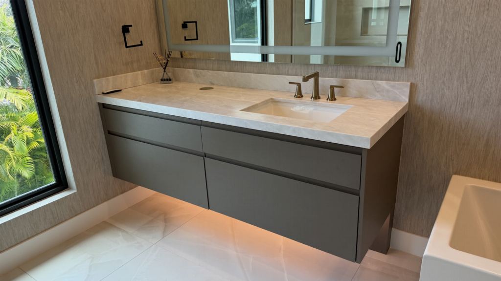 Floating marble vanity with vessel sink and full-height mirror panel